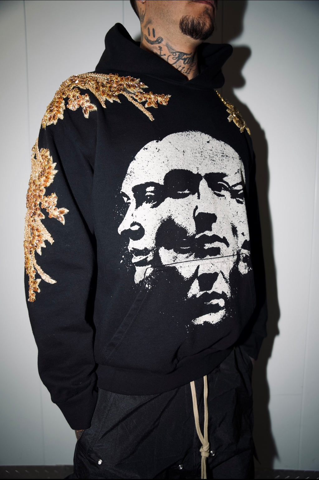 THE GILDED FACES HOODIE.     FEATURING HAND-SEWN GOLD CRYSTAL MOTIFS 1/1